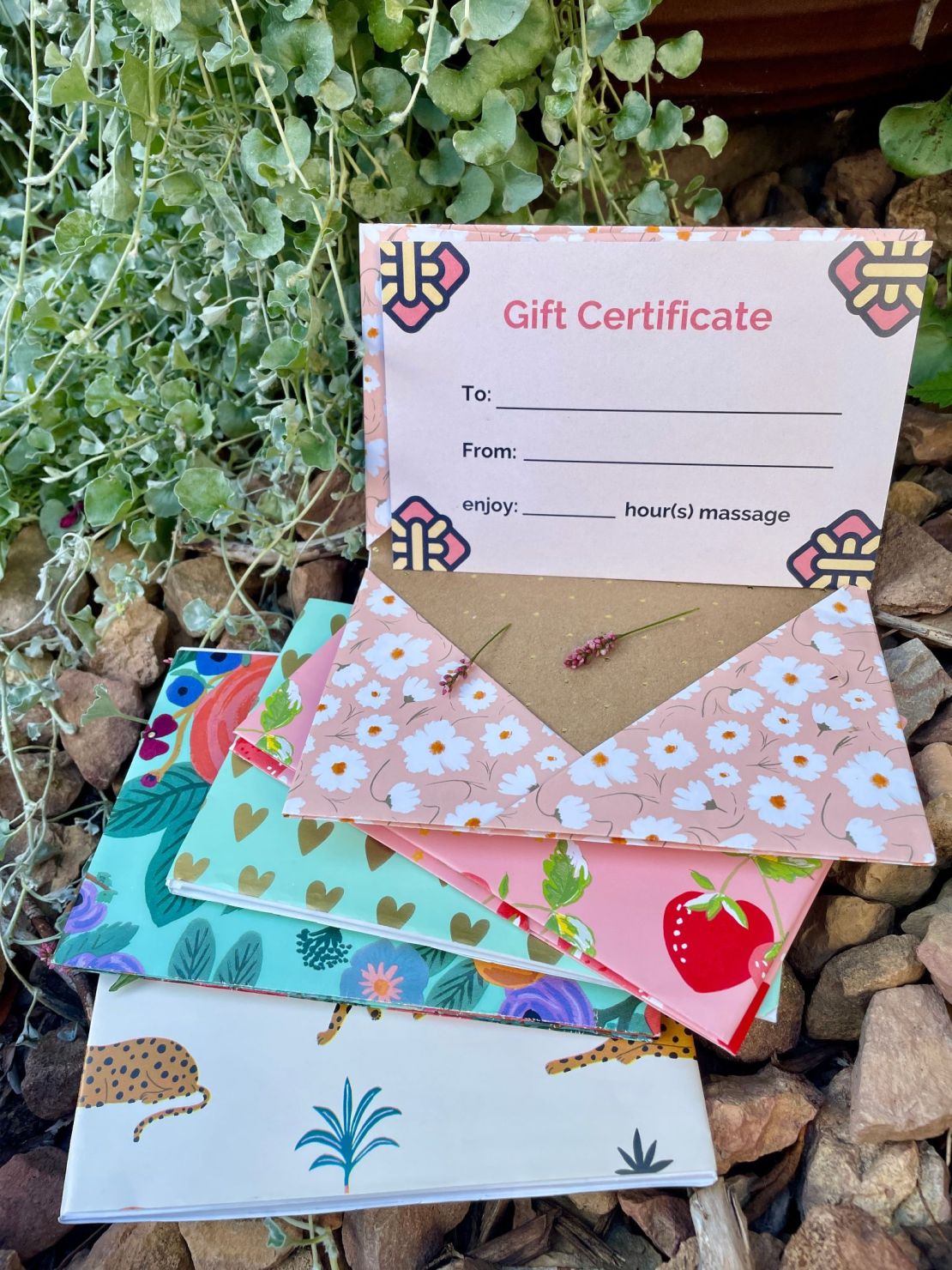 Massage gift certificates with beautiful envelopes made from wrapping paper